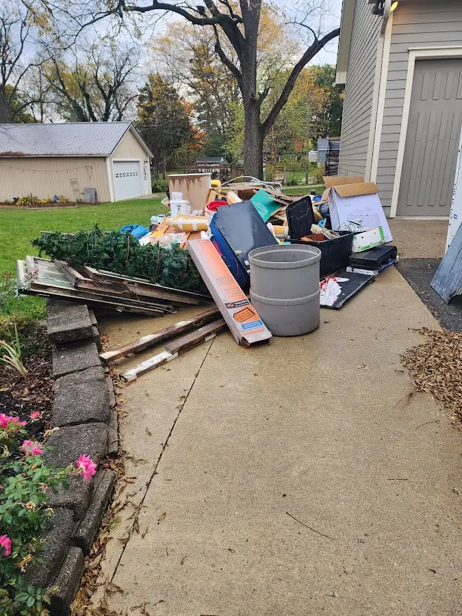 Dumpster being loaded with debris for 30 Yard Dumpster Rental in McDonough